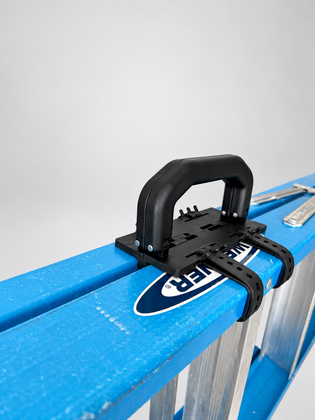Close-up of Ladder Lugger attached to an A-frame ladder